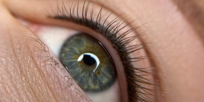permanent eyeliner makeup close up. Healthy and clean skin young woman