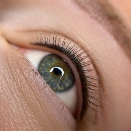 permanent eyeliner makeup close up. Healthy and clean skin young woman